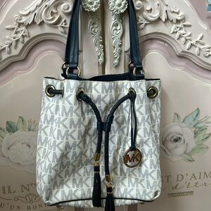 Michael Kors, bucket bag, blue, and white with gold trim hardware good condition